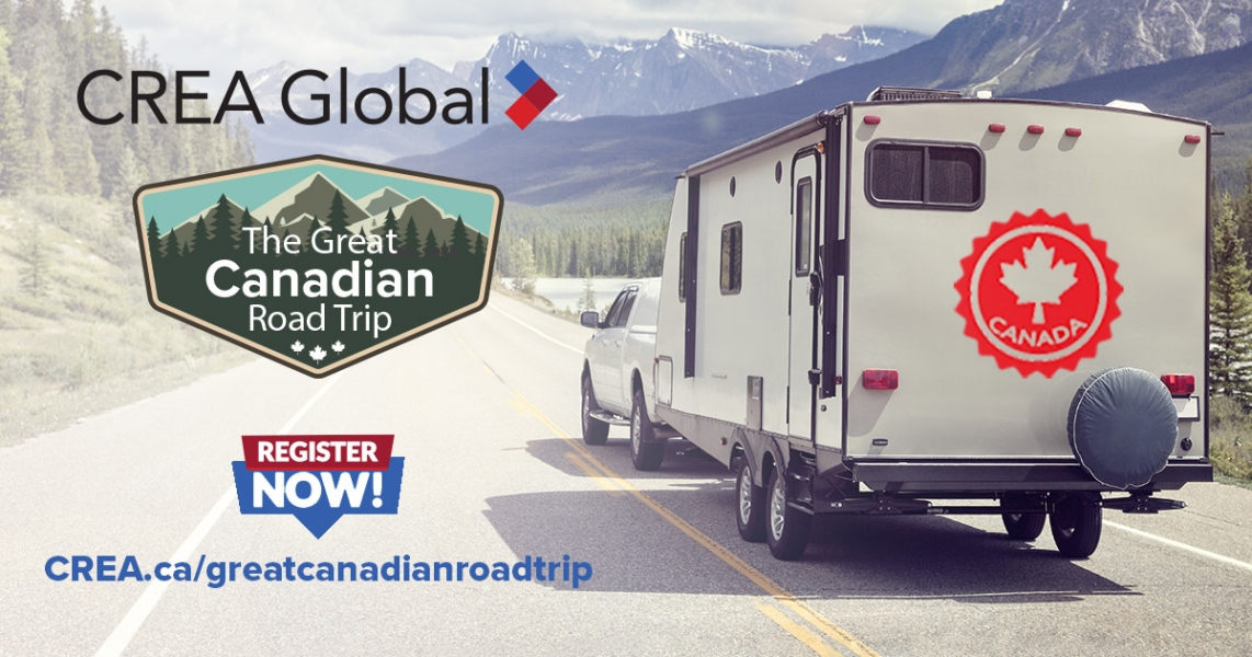 CREA Global truck towing an RV driving down the mountainous highway